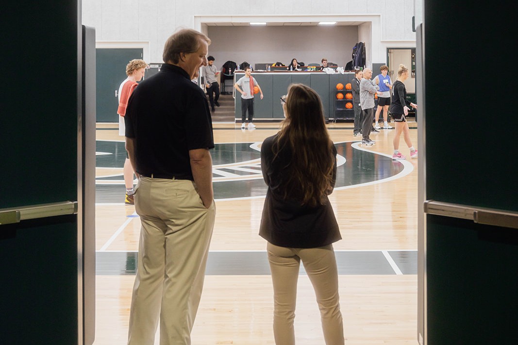 two sports medicine physician's assistants on sideline for medical coverage of basketball practice