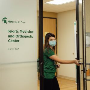 a patient exiting the MSU Health Care Sports Medicine clinic