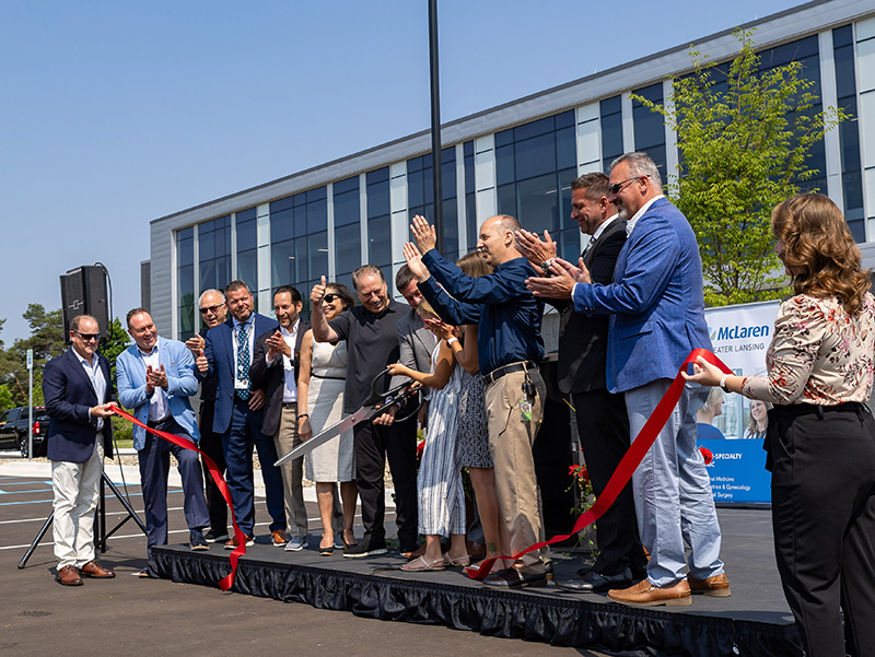 Gillespie Group, McLaren Greater Lansing, MSU Health Care, and Corewell Health Helen DeVos Children’s Hospital cut ribbon on Izzo Family Medical Center