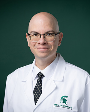 general surgeon Patrick huck in white labcoat
