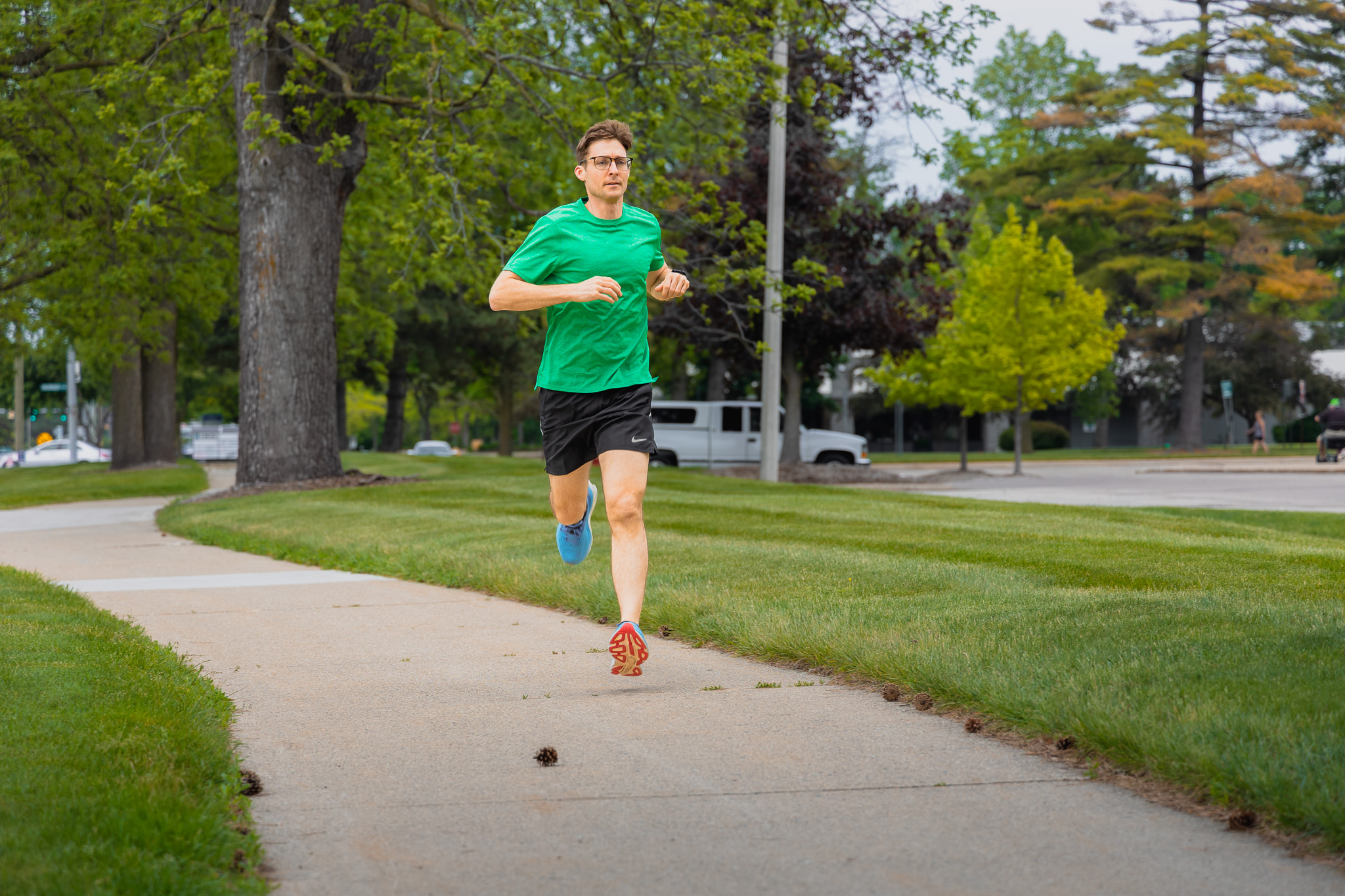 Geoff Severin runs on a sidewalk near the Michigan State University campus